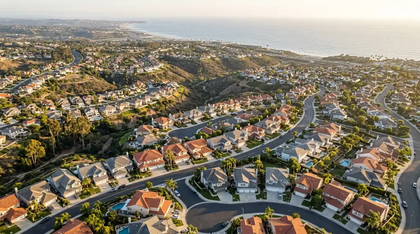 Aerial view of San Diego neighborhoods with attached garages rolling toward the Pacific